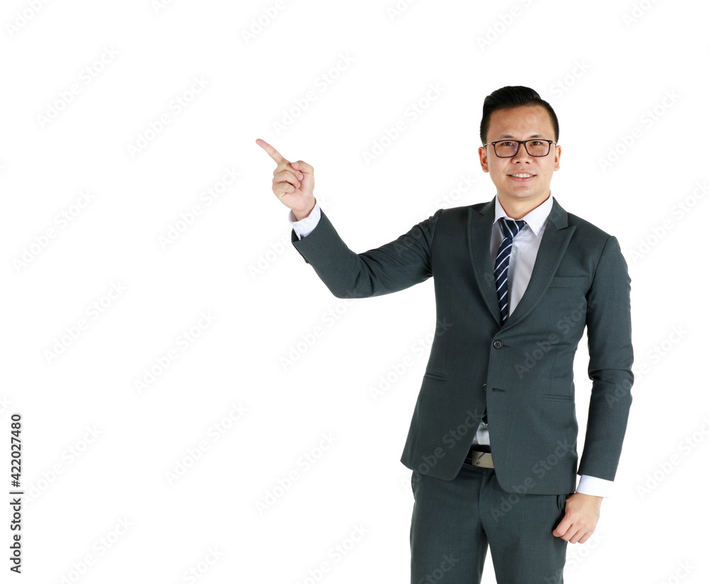Young and handsome businessman executive look, wearing dark gray suit and eyeglasses standing with friendly face and self-confidence and pose hand in advertising pointing finger to blank copy space Young and handsome businessman executive look, wearing dark gray suit and eyeglasses standing with friendly face and self-confidence and pose hand in advertising pointing finger to blank copy space