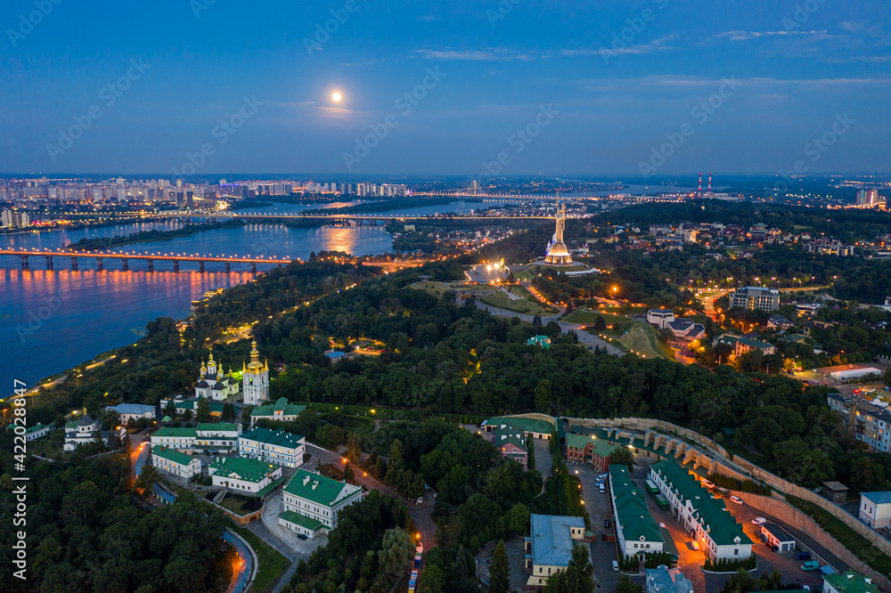 Obraz premium Beautiful summer top view of the Kiev-Pechersk Lavra. Many churches. Beautiful panorama of Kiev in the evening.