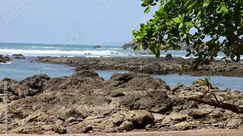 Stony coast, the sea and waves in the Corkovado National Park on the Osa Peninsula, Costa Rica photo