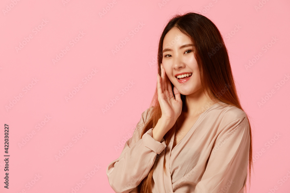 Full body portrait of cute Asian young woman with black long hair standing and smiling to camera with positive friendly and self-confidence