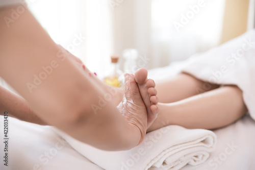 Close up Young woman getting Foot Reflexology massage at beauty spa salon. Massage for health