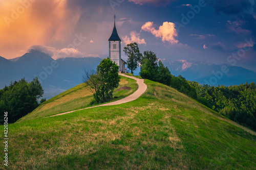 Saint Primoz mountain church at sunset, near Jamnik, Slovenia