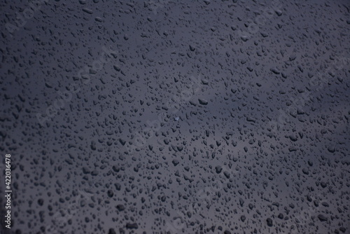 texture of raindrops on the windshield of the car