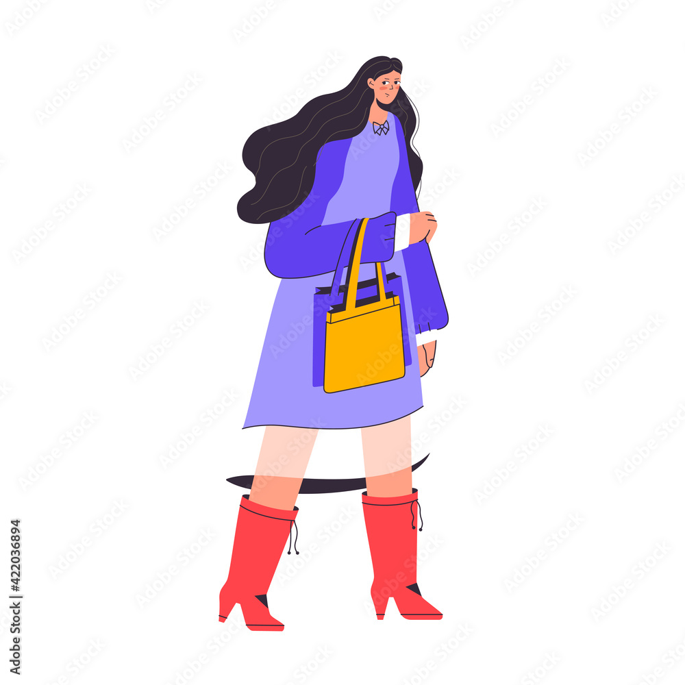 Cute woman wearing dress holds two bags in her hand