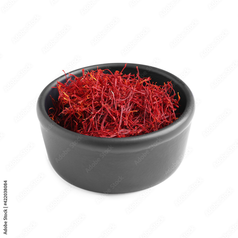 Fototapeta premium Dried saffron in bowl isolated on white