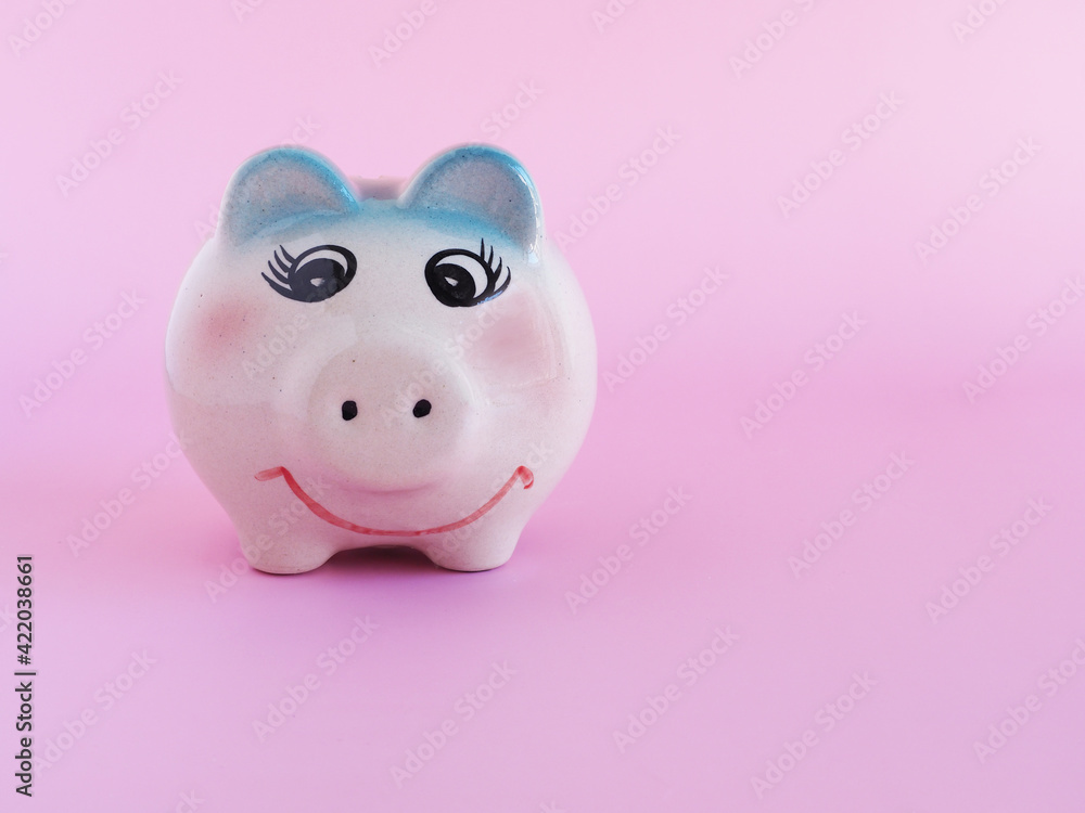 Smiley face piggy on pink color background. Space for your text, Saving money, investment, business concept.. Smiley face piggy on pink color background. Space for your text, Saving money, investment, business concept..