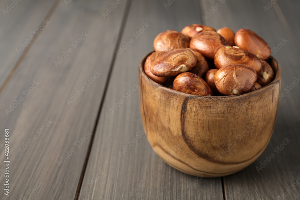 Bowl of jackfruit seeds on wooden table. Space for text Bowl of jackfruit seeds on wooden table. Space for text