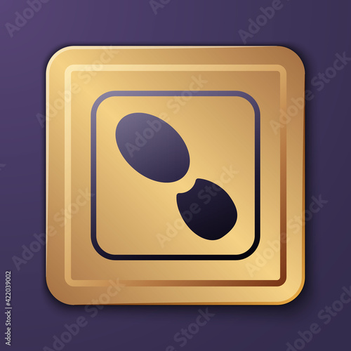 Purple Human footprints shoes icon isolated on purple background. Shoes sole. Gold square button. Vector