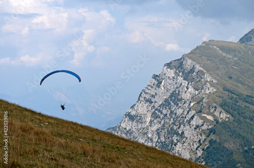 Flying on a paraglider. View of the Monte Baldo mountain, Italy, from a height.