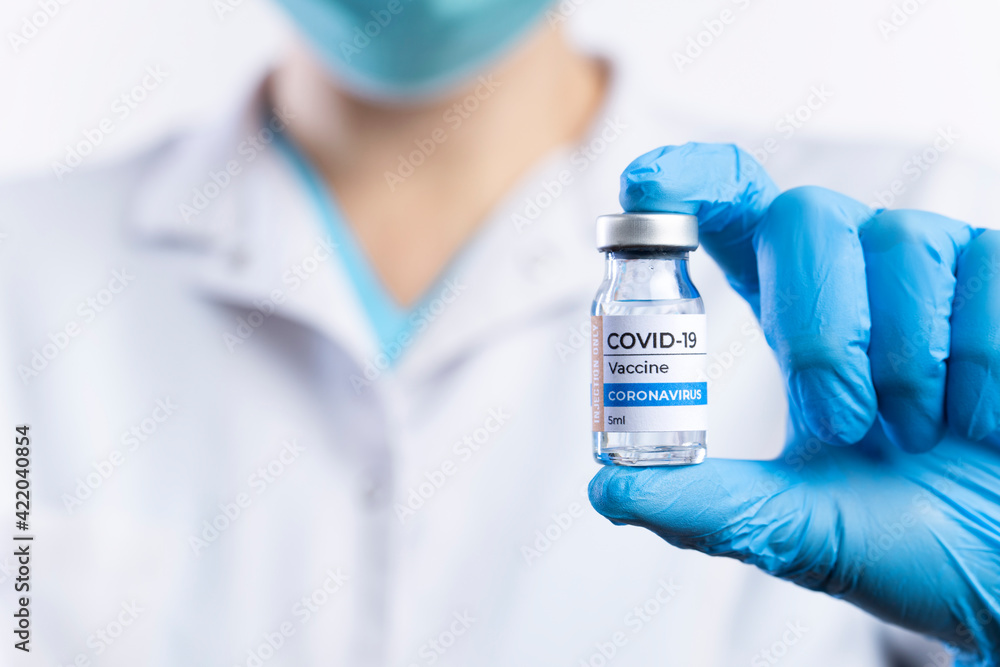 Doctor holding vaccine of new coronavirus.