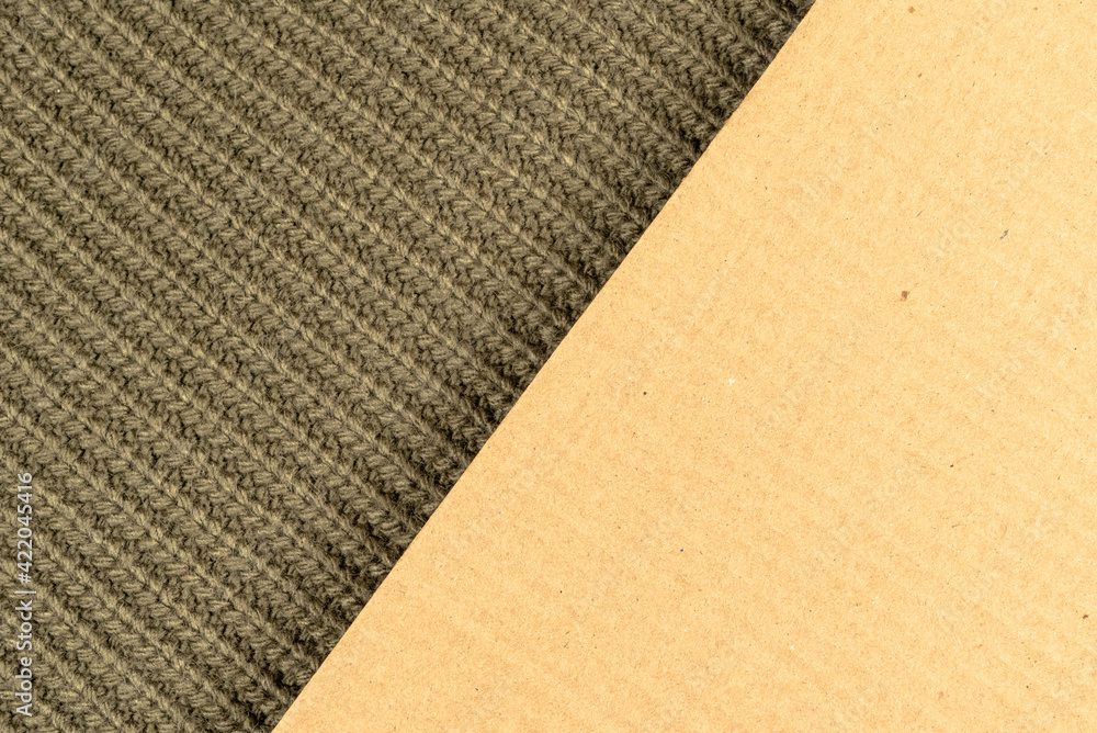 Fototapeta premium Woolen cloth, texture of green wool, close-up and surface for copy space made of cardboard