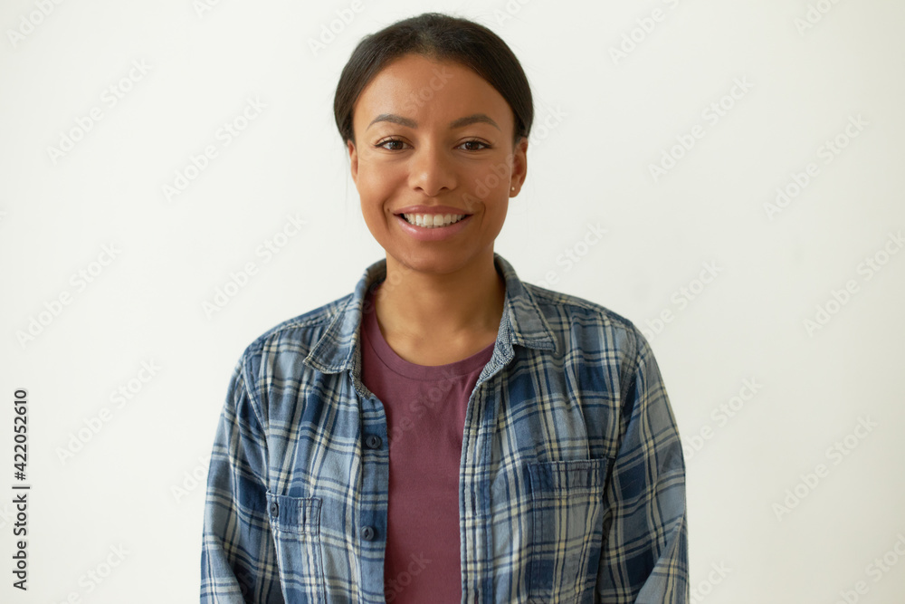 Joy and happiness. Pretty black student girl smiling happily after passing all exams with excellent marks. Cute young mixed race woman rejoicing, staying optimistic about future, enjoying life Joy and happiness. Pretty black student girl smiling happily after passing all exams with excellent marks. Cute young mixed race woman rejoicing, staying optimistic about future, enjoying life