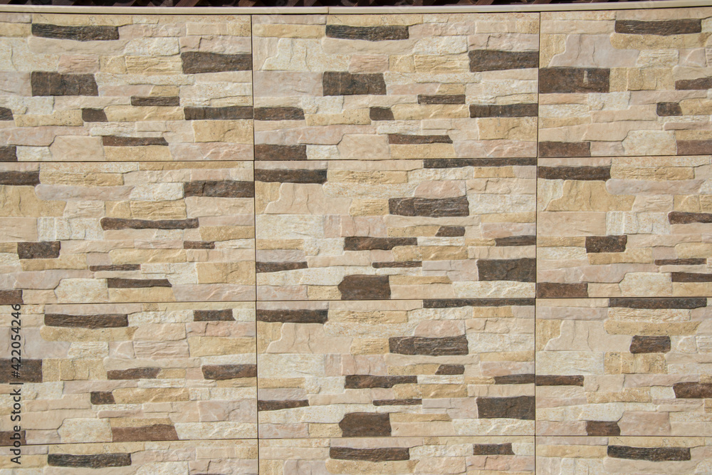 Brown bricks wall pattern, wall texture made from natural stones for interior of exterior, building, brick decoration Brown bricks wall pattern, wall texture made from natural stones for interior of exterior, building, brick decoration