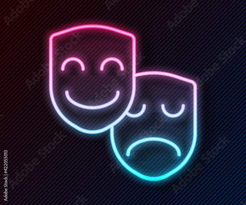 Glowing neon line Comedy and tragedy theatrical masks icon isolated on black background. Vector