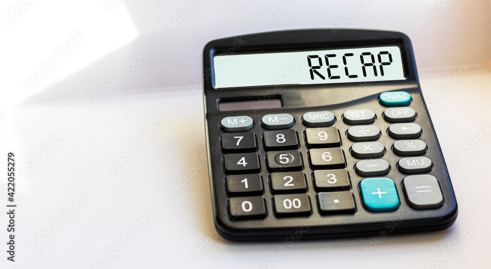 Business and finance concept. On the calculator the inscription - RECAP, on a white background Business and finance concept. On the calculator the inscription - RECAP, on a white background