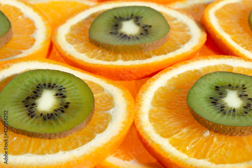 Citrus orange fruits slices and kiwi slice background