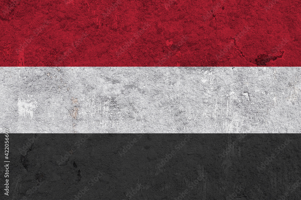 Fahne von Jemen auf verwittertem Beton