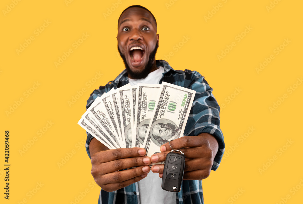Excited African American Guy Showing Money Posing Over Yellow Background Excited African American Guy Showing Money Posing Over Yellow Background
