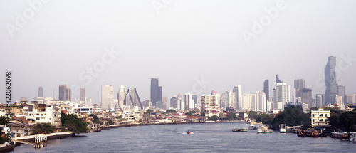 Bangkok  cityscape building with river and boat background. skyline