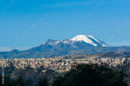 Landscape with a volcano and a beautiful city  photo