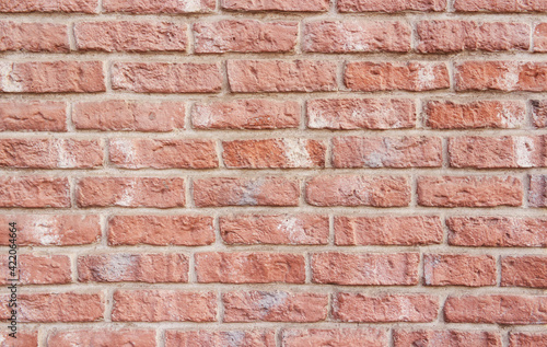 Simple hand made brick wall brickwork. High detailed brick wall.
