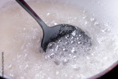 Картината върху платно making caramel. Cooking sugar to caramelize. caramelize sugar