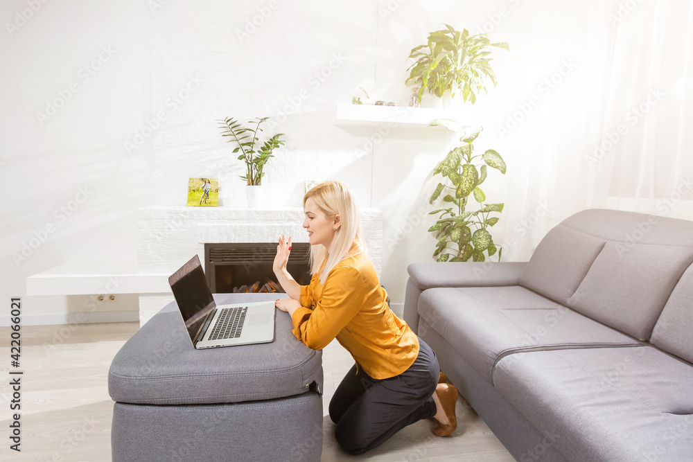 Beautiful young woman working on her laptop at home Beautiful young woman working on her laptop at home