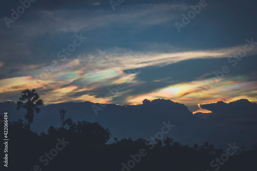  A Rare Look at an Iridescent Cloud. fire rainbows or rainbow clouds. Iridescent Pileus Cloud colorful optical phenomenon sky