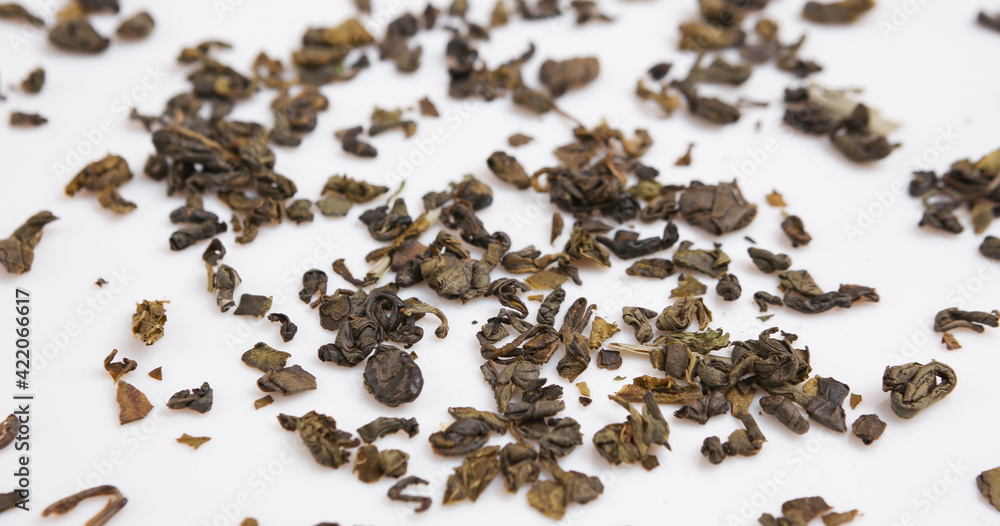 Green tea granules isolated on white background Green tea granules isolated on white background