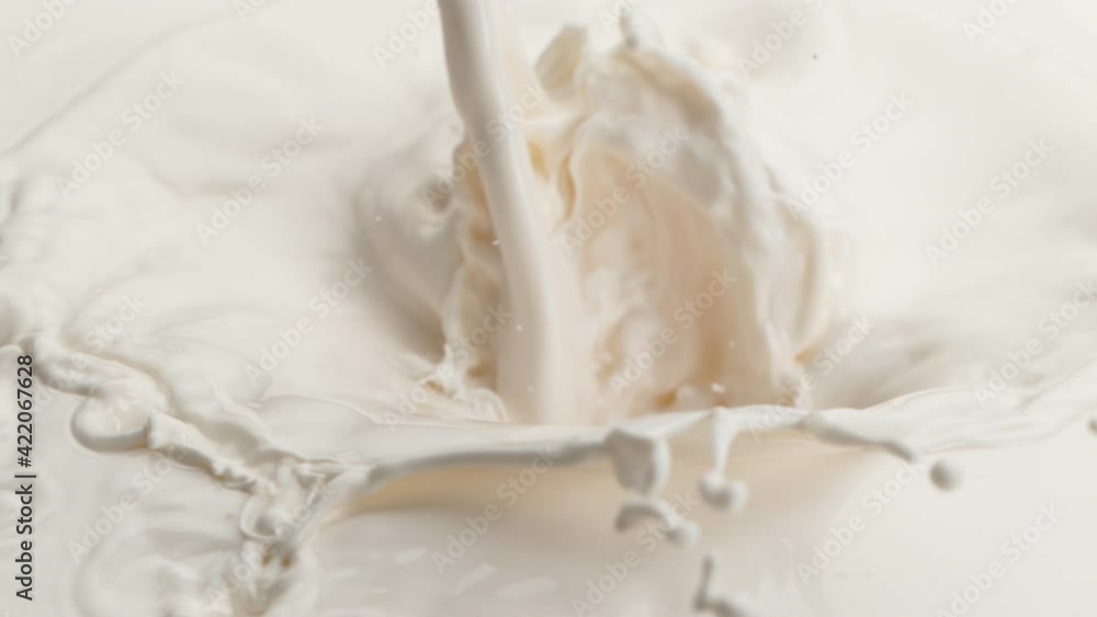 Super slow motion of pouring milk splash. Filmed on high speed cinema camera, 1000 fps. Super slow motion of pouring milk splash. Filmed on high speed cinema camera, 1000 fps.