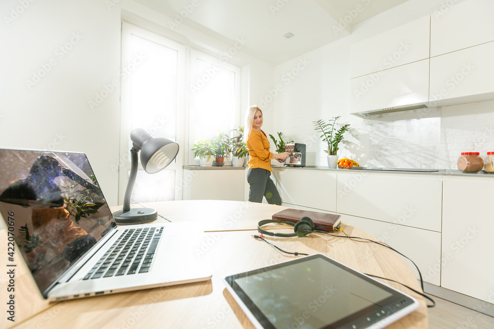 Fototapeta premium laptop on wood table in modern kitchen room.