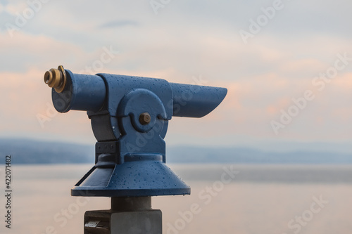 binocular at observation desk at sea beach