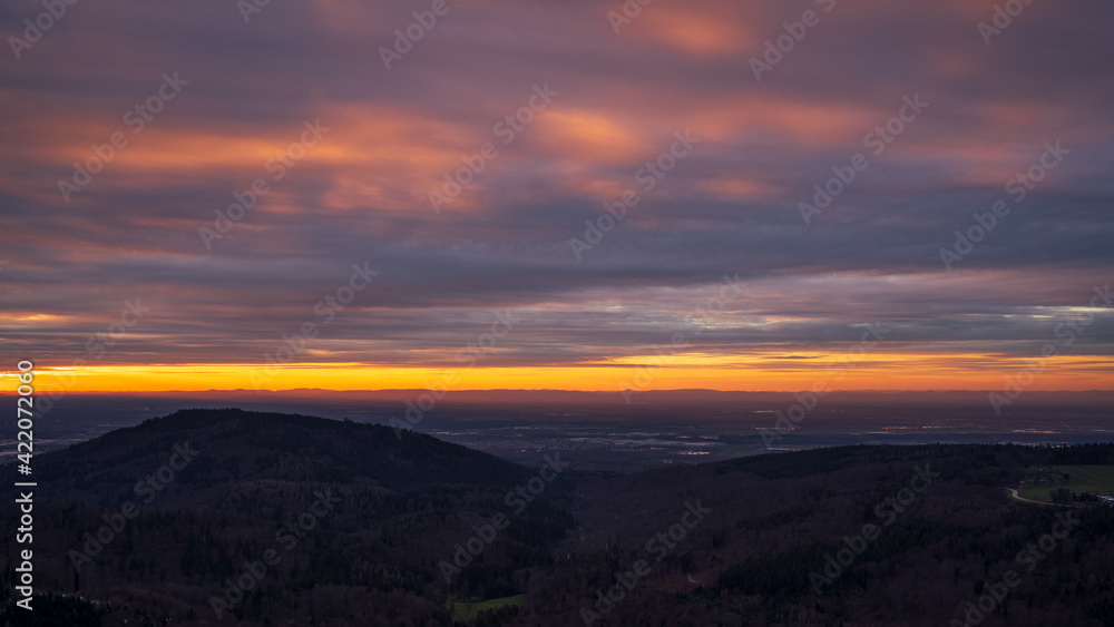 Colourful sunset in the rhine plain in the northern black forest