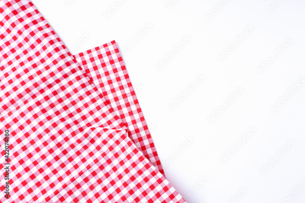 Red and white fabric scotch pattern on white background top view and with copy space.