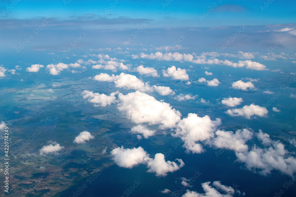 Beautiful fluffy clouds are seen from an unusual angle