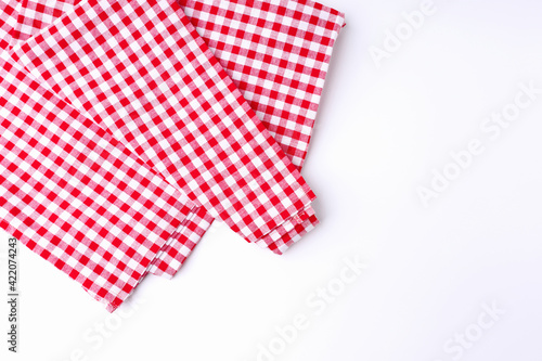 Red and white tablecloths crumpled on white the table.