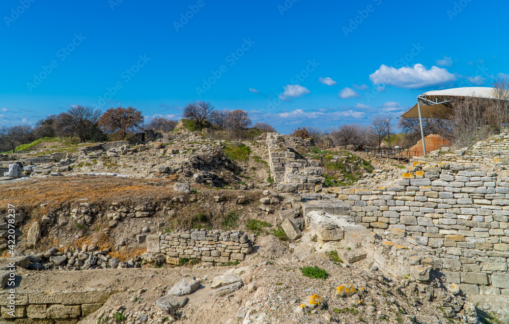 Panoramic view of ruins and walls in the archaeological park of the ancient city of Troy near Canakkale, Turkey