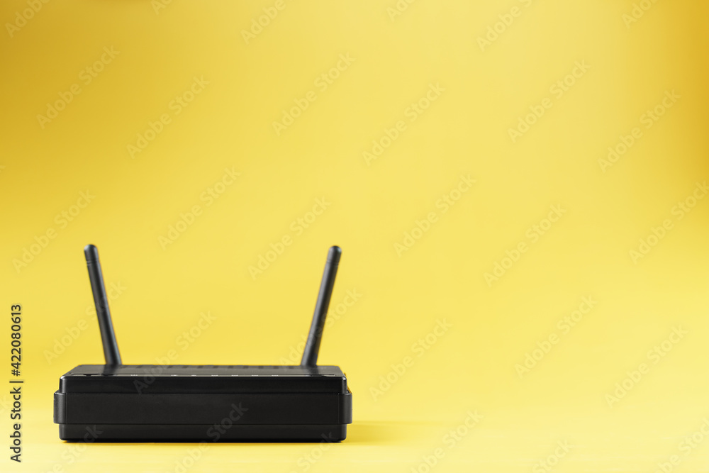 Fototapeta premium Router wireless LAN technology with devices based on IEEE 802.11 standards on a yellow background free space top view.