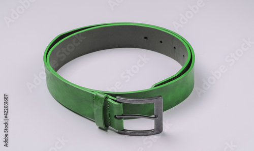 Leather green belt on a white background