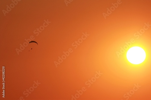 sun and parachutist