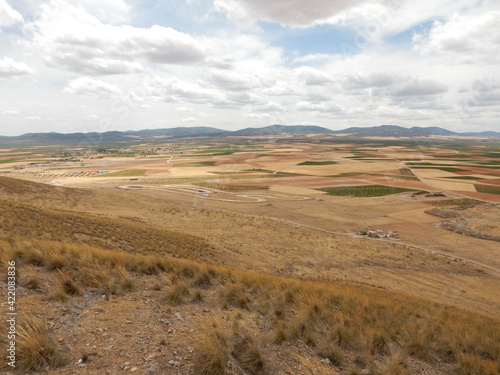 Spanish Countryside in Summer Spanish Near Toledo, Spain, from The Cerro Calderico Ridge at Consuegra that inspired Miguel de Cervantes to Write Don Quixote of La Mancha photo