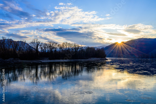 Reflections of the setting sun in the Danube river