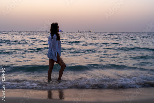 Woman at the beach during the sunset © Sergio