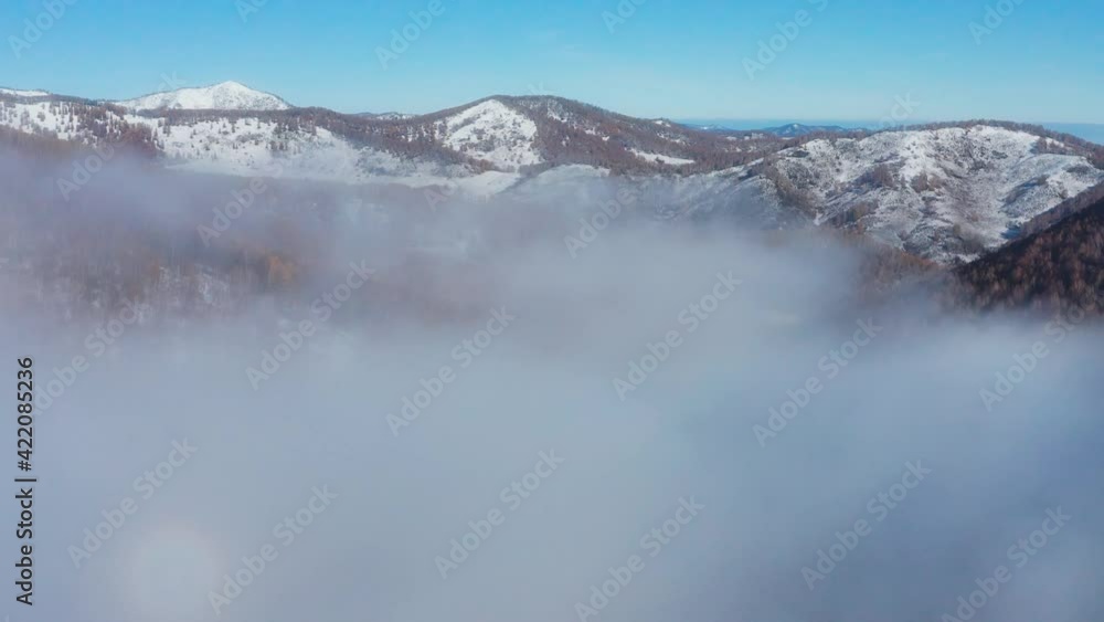 Altai mountains in autumn. Seminsky ridge. Fog in the mountains. Aerial view. Altai mountains in autumn. Seminsky ridge. Fog in the mountains. Aerial view.