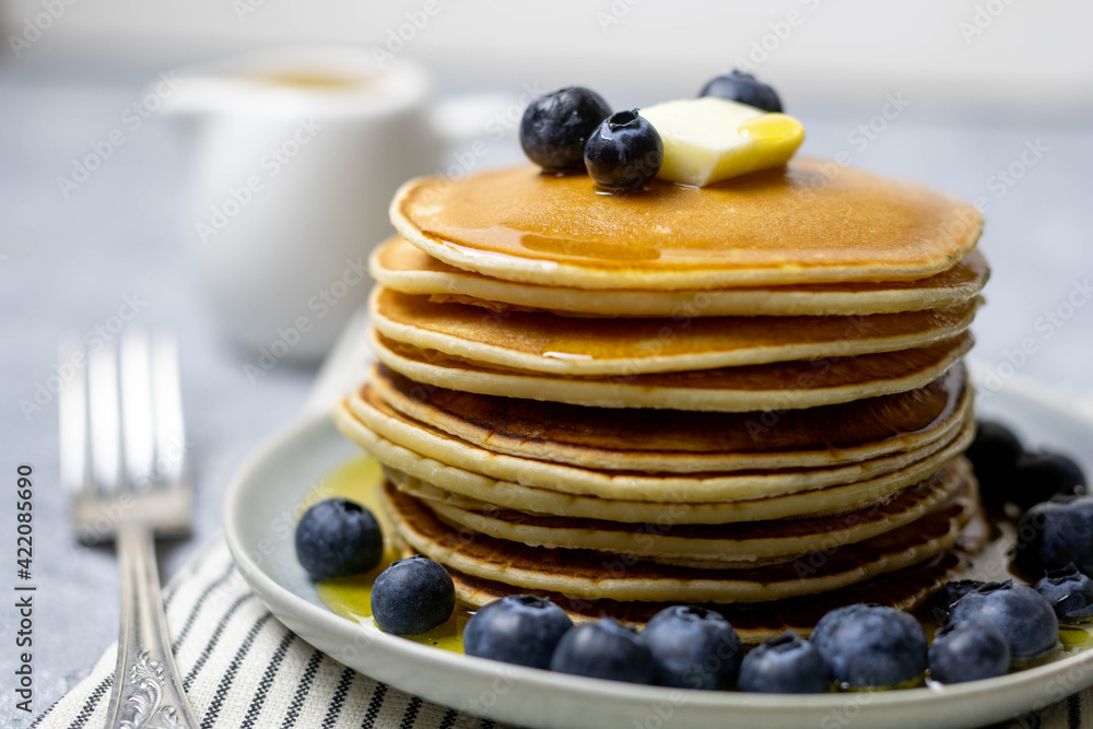 Pancakes with blueberries, butter and honey. Breakfast. Pancakes with blueberries, butter and honey. Breakfast.