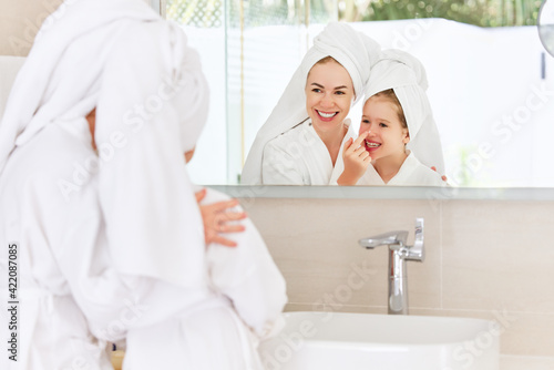 Loving mother and daughter during spa skin care