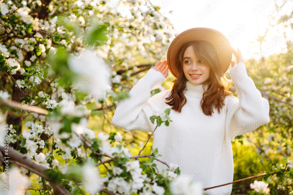 Beautiful young woman near blooming spring tree. Youth, love, fashion, romantic and lifestyle concept. Beautiful young woman near blooming spring tree. Youth, love, fashion, romantic and lifestyle concept.