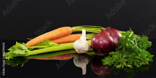 Carrots, celery, onion and garlic.The ingredients for an Italian Soffritto photo