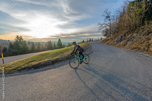 Women cycling on the mountain road  