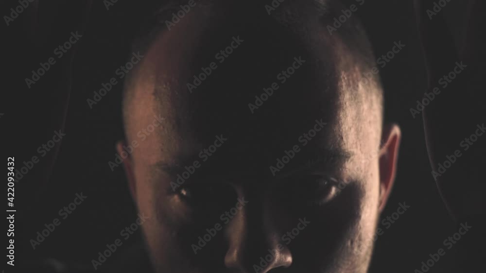 Portrait of a man in a black shirt. Light and shadow Portrait of a man in a black shirt. Light and shadow